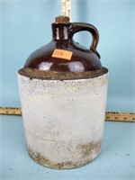 Stoneware jug with chips and discoloration
