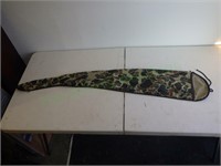 Camouflage rifle sleeve for storage.