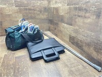 Briefcase, clothes hangers and bar