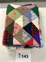 MULTICOLORED POLYESTER QUILT. 64” x 78”. Some