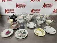Lot of teapots and teacups with saucers