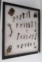 Display case with antique keys and padlocks.