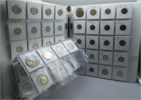 Binder of various coins including pennies,