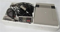 Nintendo game system with remotes and gun. Note