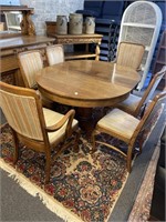 Antique oak two leave table and six chairs