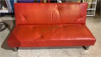 Modern orange vinyl sofa bed with built-in