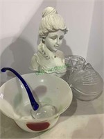 White plastic bust of a young lady, glass serving