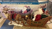 Animated reindeer and Santa on sled - molded