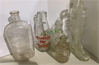 5 bottles including a boot shaped bottle, 2