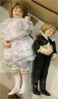 2 porcelain dolls - the girl with a white dress,
