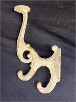 Decorative cast-iron coat hook. 8 inches tall.