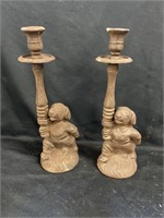 Pair of candle sticks with cast iron dogs. 12