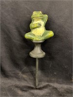 Cast iron frog hose guard. 12 1/2 inches tall