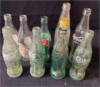 Group of Coca-Cola glass bottles bc