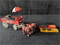 Box of Coca-Cola cast iron wagon and collectibles