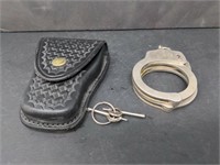 Handcuff with keys, tooled leather case