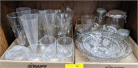 Clear glass tumblers, etched glass flutes, cut