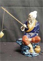 Chinese ceramic fisherman figurine