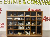 Display case of thimbles and nautical statues