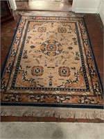 Blue, Tan, and Rust Area Rug with Fringe