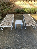 Two flat Sun Tan loungers with 2 small tables.