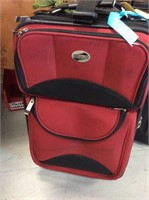 Red American Tourister carry-on suitcase