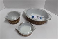 Three Brown Pyrex Covered Baking Dishes