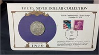 Coin, 1879 Morgan silver dollar, with stamps and