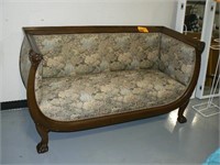 ANTIQUE CARVED CLAWFOOT AND LION'S HEAD SETTEE
