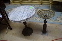 Two marble top brass based circular coffee tables