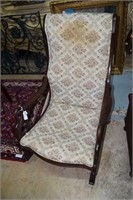 Swan arm rocking chair with needlepoint