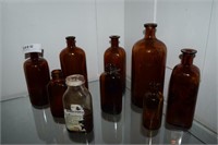 9 Assorted Early Brown Glass Medicine Bottles