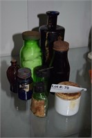 Eight cobalt, green & milk glass medicine bottles