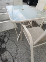 Rectangular patio table with 6x patio chairs.