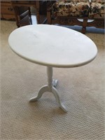 Wooden tilt top painted side table.