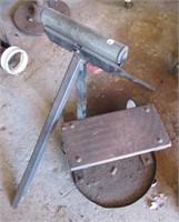 Shop stool with roller guide.