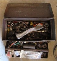 Metal tool box filled with various fittings.