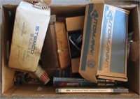 Garage items including car door handles, manuals,