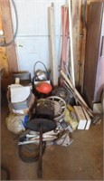 Garage items including hard hat, tripod, wire,