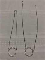Lot of 2 silver toned ring necklaces