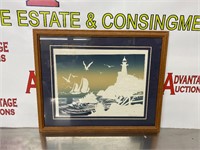 Embossed serigraph lighthouse picture.