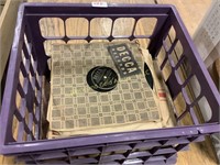 Crate of vintage records in paper covers