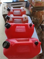 5 Plastic gas cans.