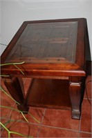 Wooden end table with glass top