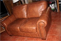 Nice leather loveseat, 66" x 38" x 20" floor to