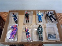Figurines in plastic boxes