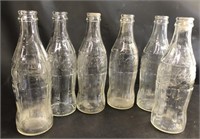 6- Coke bottles