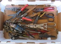 Collection of hand tools including scissors,