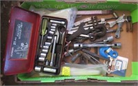 Various tools including wrenches, drill bits,