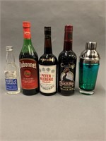 4 Liquor Bottles and Cocktail Shaker.